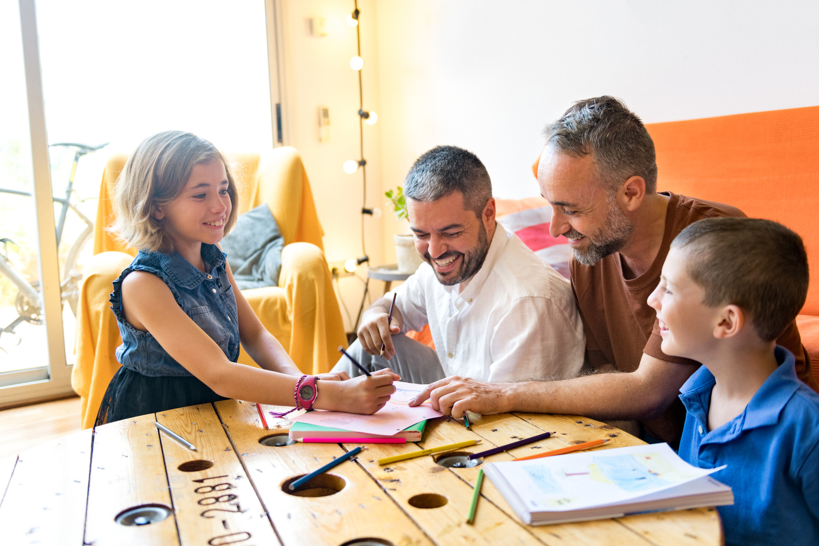 Gay Couple and Their Children Coloring on Paper 